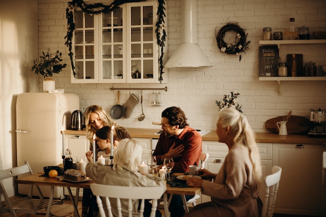family sitting at kitchen table