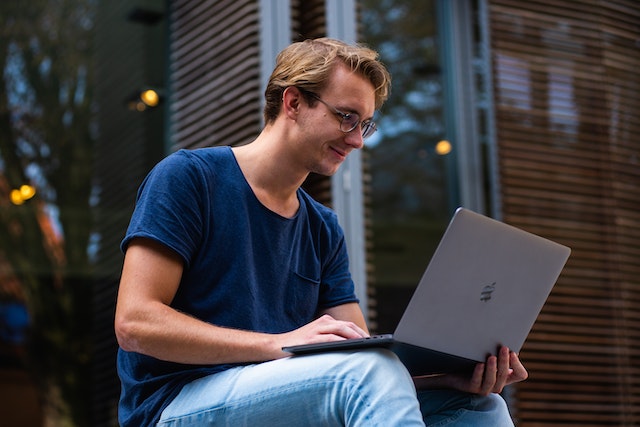 man using laptop for online marketing